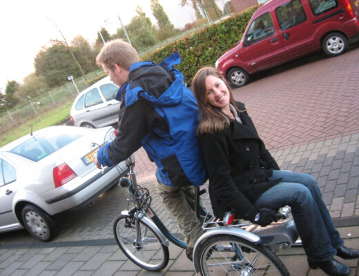 Julie enjoying a ride on her husband's tri-cycle.